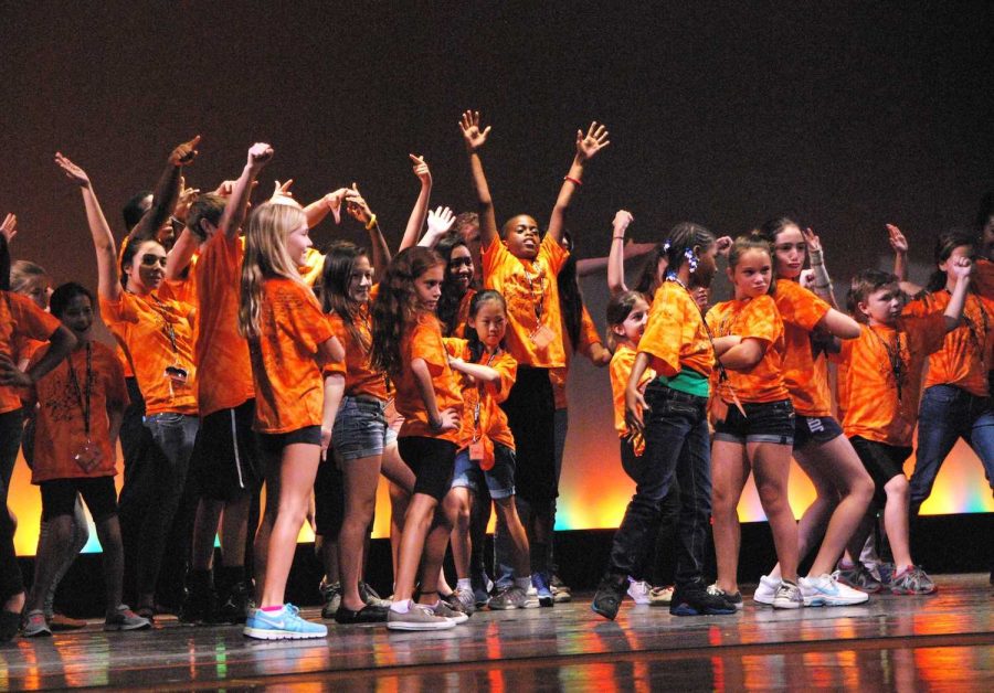 Orange star campers perform the dance that they learned throughout last week for an audience of parents this past Saturday. The camp took place all of last week and is entirely student run. Children ranging from ages 4-12 attended and learned about all of the art majors at Dreyfoos, engaging in activities and games involving the arts.