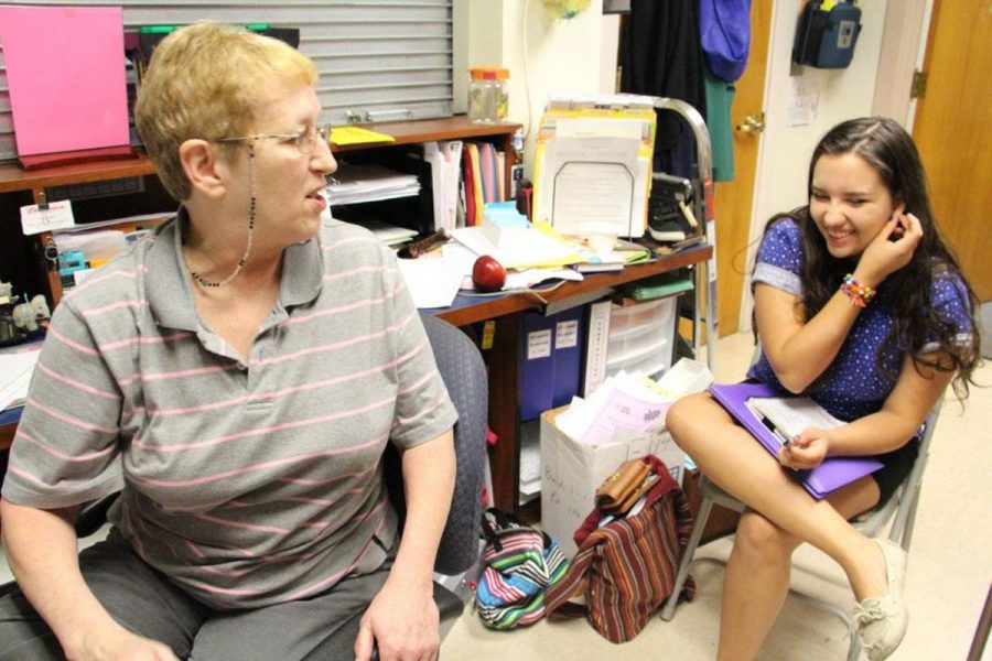 Communications senior Valeria Rivadeneira enjoys Student Services secretary Lynnn Berrymans anecdotes about strange items left at lost and found. For example, once she found a mannequin with a football for its head. 