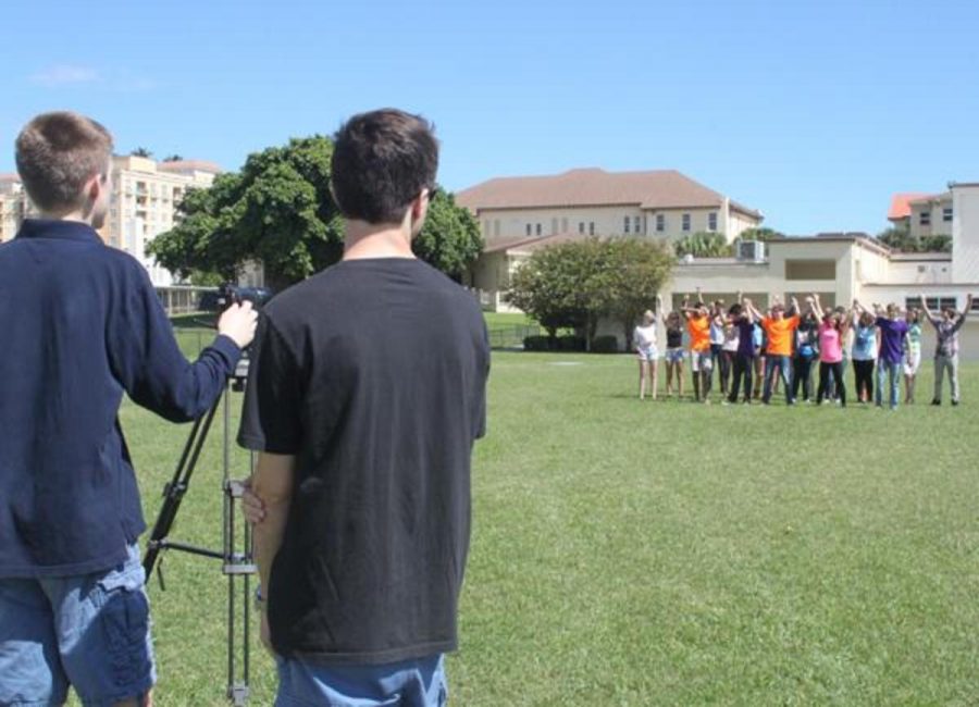 Communications students from two seperate film classes merge together to shoot a scene for a project.
