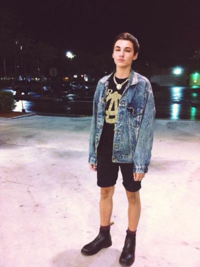 Theatre senior Brennan Felbinger in a casual grunge look ,featuring a denim jacket and his signature Chelsea Doc Marten Boots.