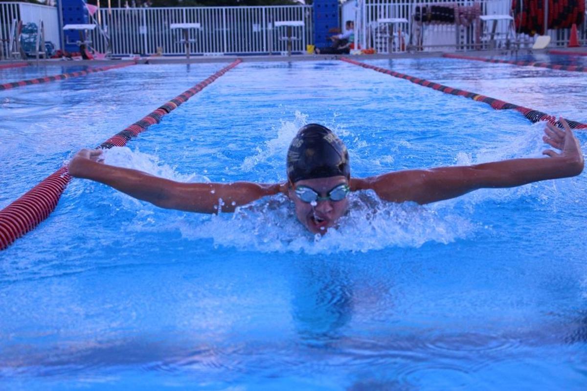 Keyboard senior Abigail Schirmer
swims the butterfly during a practice at Gaines Park. Even though
Schirmer placed in the Freestyle swim event, she still likes to practice all the different swim strokes.