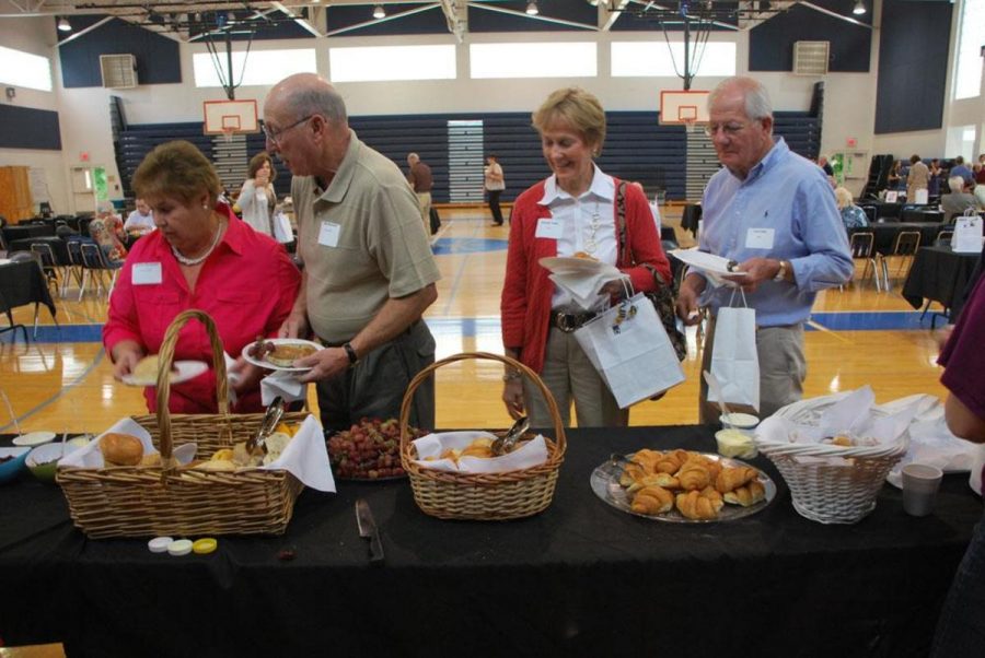 Granparents pass through the breakfast table during the Gradnparents Day event hosted by the School of Arts Foundation today.