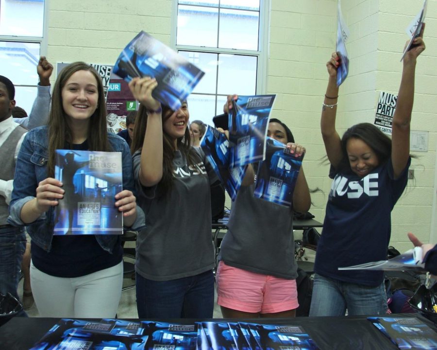 (From left) communications junior Maddi Fitzgerald, seniors Jennifer Yoon, Jensen Tate and sophomore Michelle Birch dance while passing out our Issue 2. Today during lunch, Muse staffers held a Distribution Party during lunch in the cafeteria.