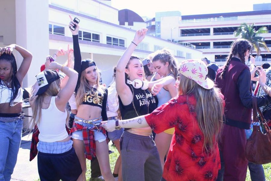 Students dressed in rap clothing dance during the Lunch Pep Rally during the first day of Spirit Week 2014.