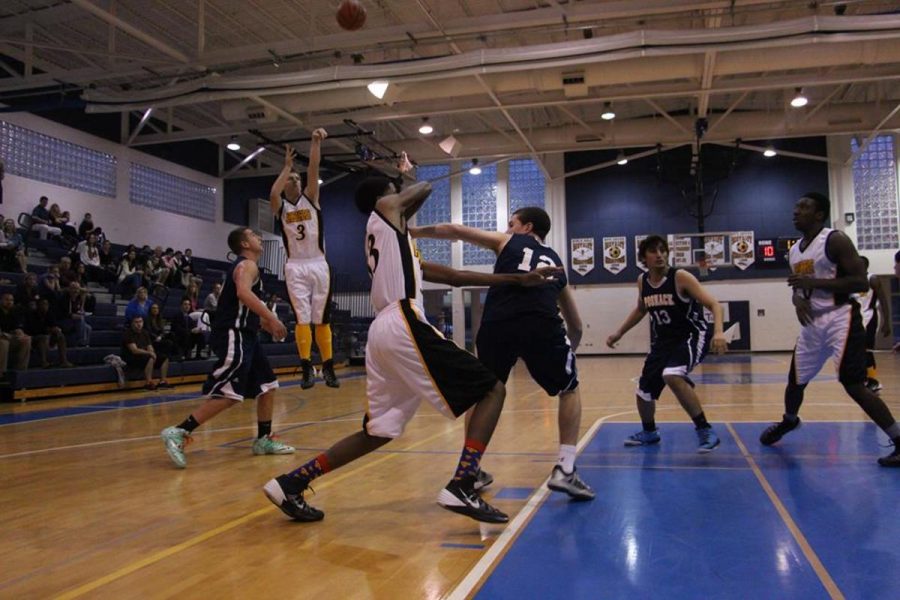 Communications junior Matt Charlton taking a shot during the Homecoming Basketball game which resulted in a win for Dreyfoos 57-48.