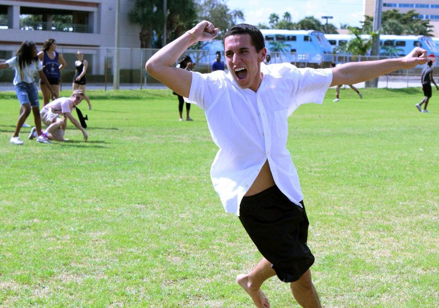 Digital media senior Jordan Starkey celebrates making it to the finish line today during lunch during the three-legged race.