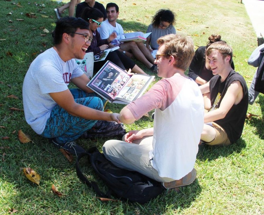 Keyboard senior Ian Lao (left) shares a moment with visual seniors Allan Doyle (middle) and

Collin Kroll (right) while signing each other’s yearbooks during senior sign out.