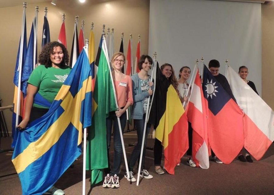 Communications+junior+Summer+Marsh+%28second+from+left%29+proudly+holds+the+Brazilian+flag+along+with+other+students+part+of+her+local+RYE+program.