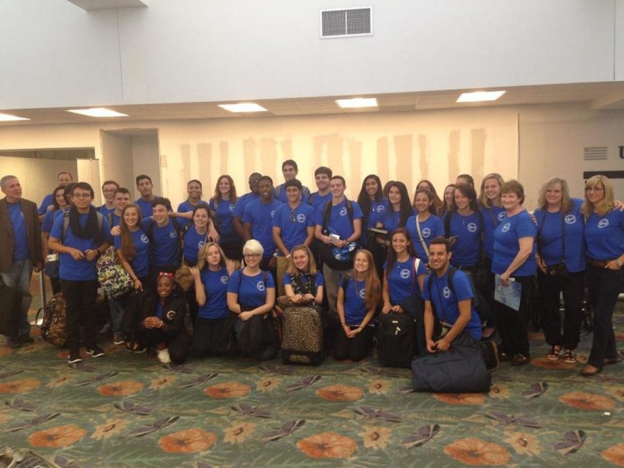 The 32 vocal  students at the Fort Lauderdale Airport before embarking to Wales  for a choral competition .