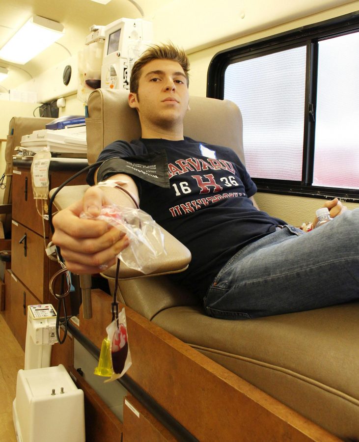 Theatre senior Jacob Posner participates in the first National Honor Society blood drive of the year. 