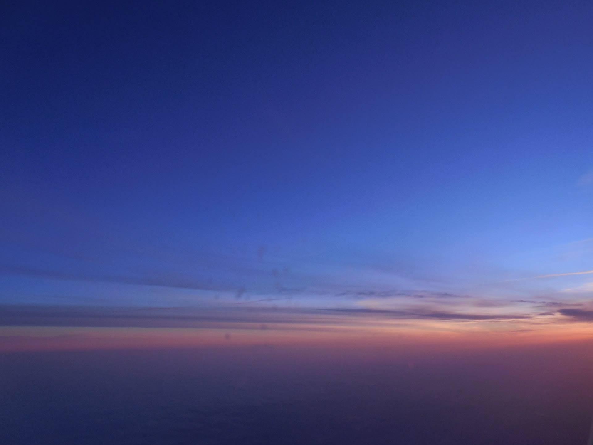 Sun rise over Germany on a plane. 