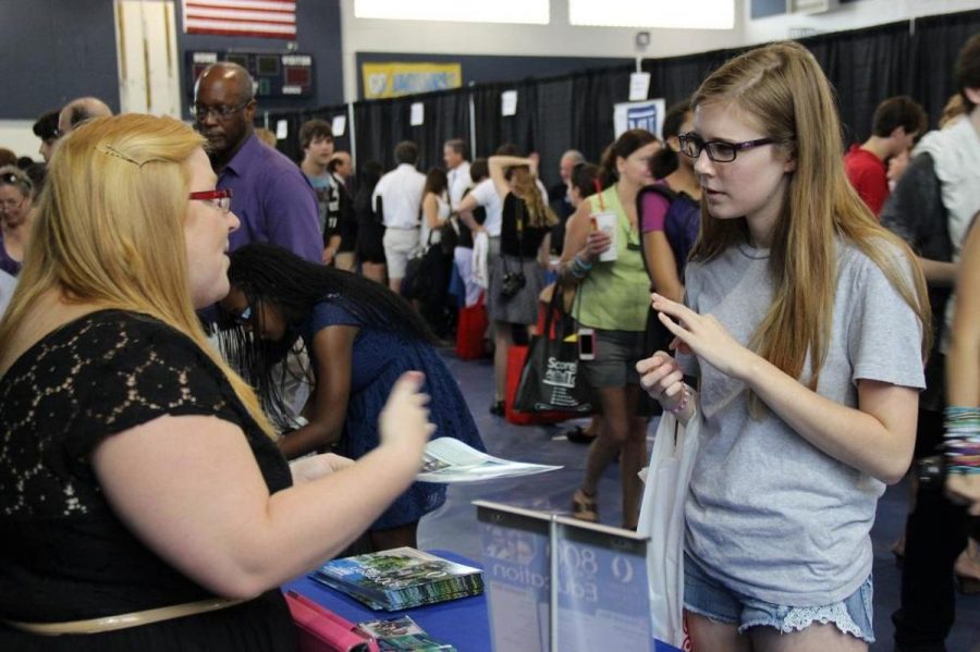 Senior+Emily+Hammel+%28r-l%29+speaks+to+a+college+representative.