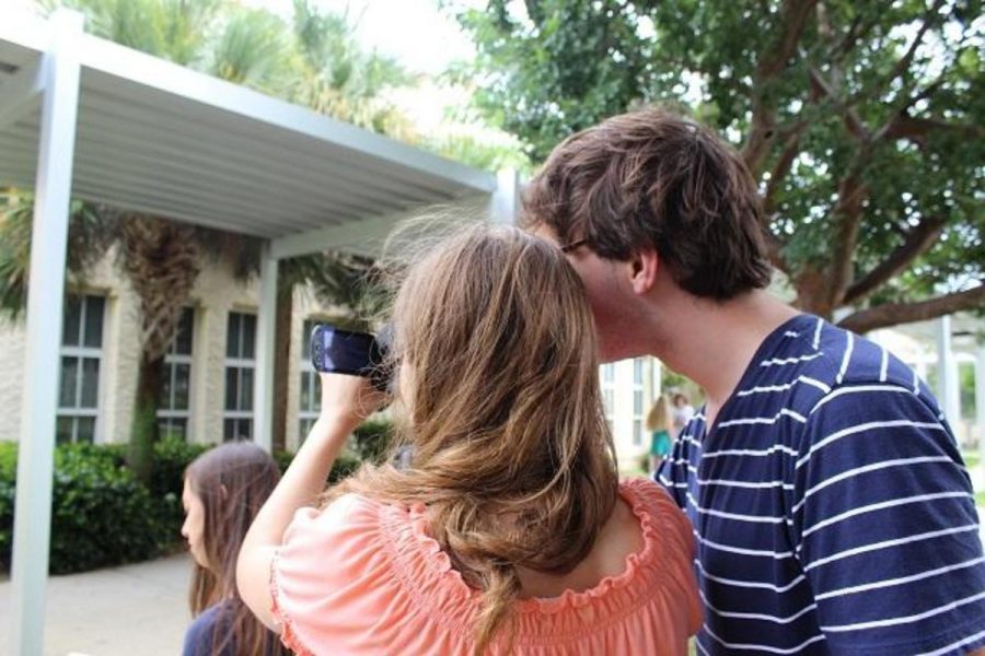 Communications freshmen Tyler Manley, Reilly Sams, and Alicia Marches line up a shot for their film class.