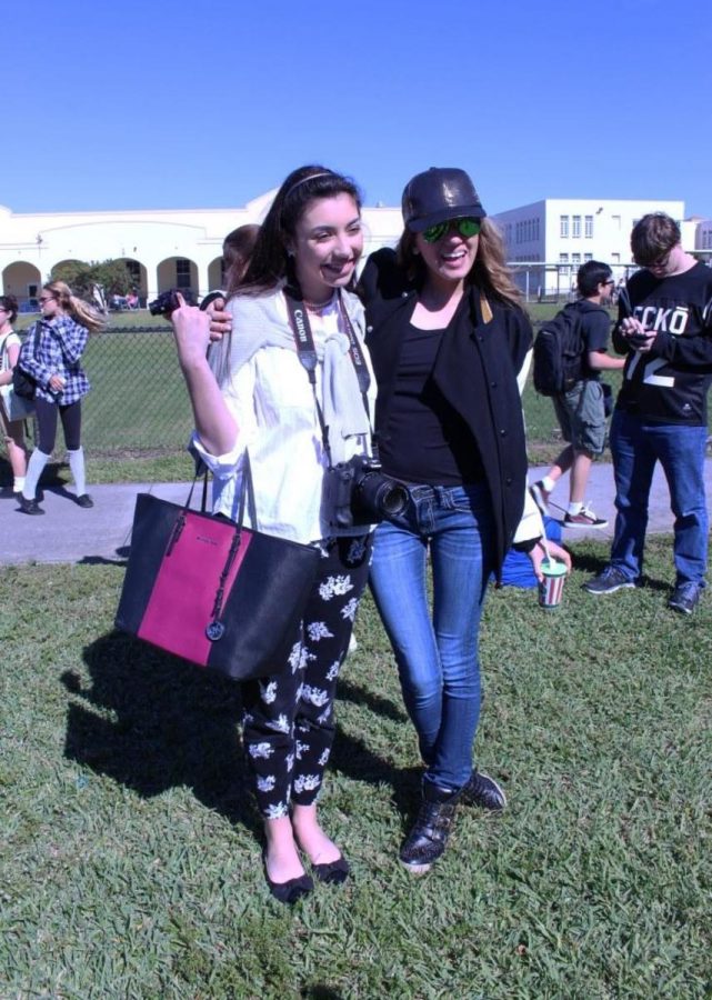 Communications sophomore Julia Horneck and visual junior Frances Landrum pose for a photo on class clique day. 