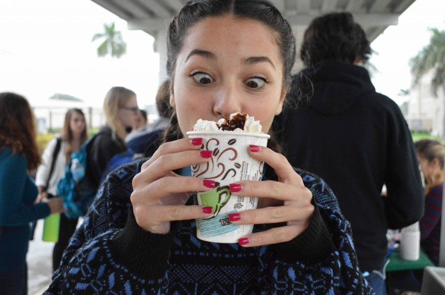Theatre sophomore Valentina Diaz poses with her deluxe Seeds hot chocolate early in the morning. 