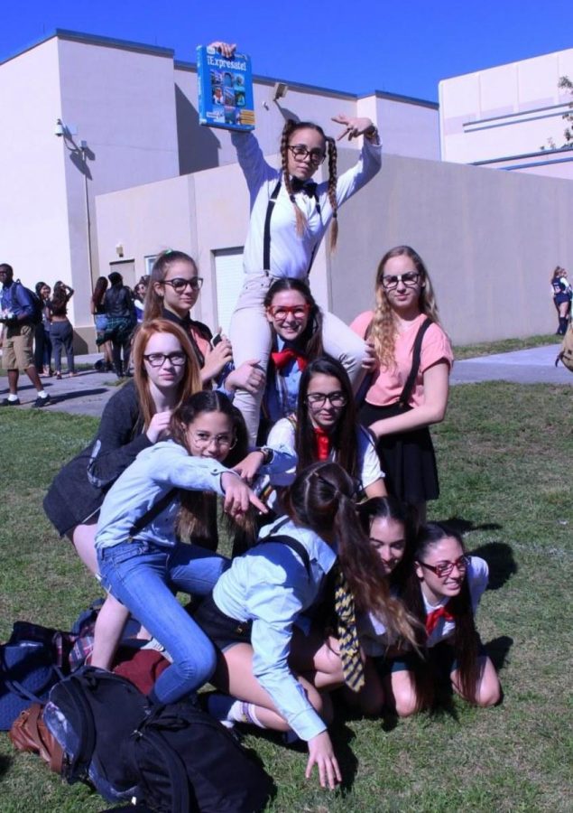 A group of freshman nerds gather on field to support their class during the Spirit Week events. 