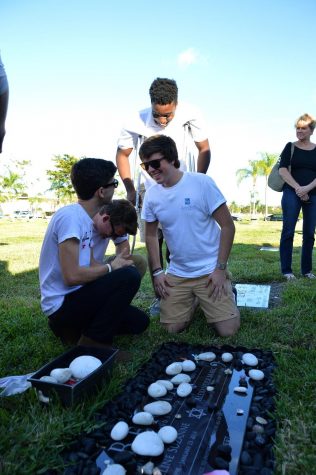 (left to right) Band senior Benedetto Salvia, digital media senior Dominik Czaczyk, strings junior Joshua Ewers and strings senior David Esposito smiling as they remember Alex and Jackie.