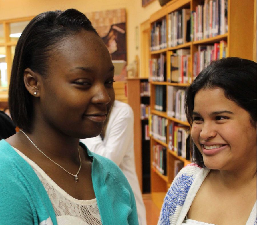 (L-R) Strings juniors Kevonna Shuford and Maria Fernandez laugh while discussing the good and bad of journalism.
“Journalism [reminds me of] being sneaky and deceptive because the news can be altered slightly depending on the source. The stuff that we hear is normally a little sugarcoated or exaggerated,” Shuford said. 
“Journalism reminds me of the truth and exploited pieces of the truth because [journalism] may be completely accurate and a good portion of journalism is that way. However, there is a lot of yellow journalism going on now. Many events are exaggerated and unreliable sources nowadays take little portions of the truth and twist them for public appeal,”  Fernandez said.
