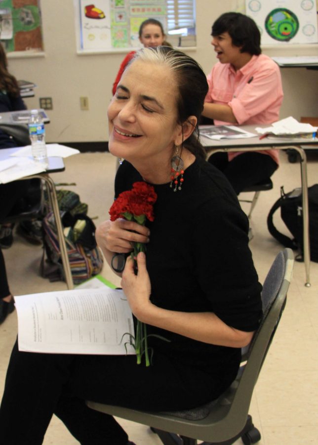 English teacher Nieves Lopez receives a carnation from the Seeds publication. The flowers were sold on Feb 13 for Valentines Day.