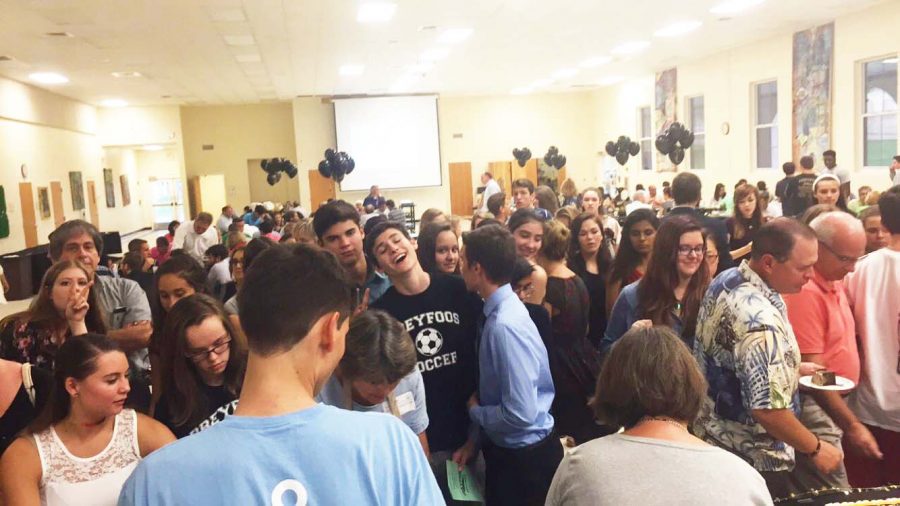 Athletes and their families crowd into the cafeteria for the annual Sports Banquet.