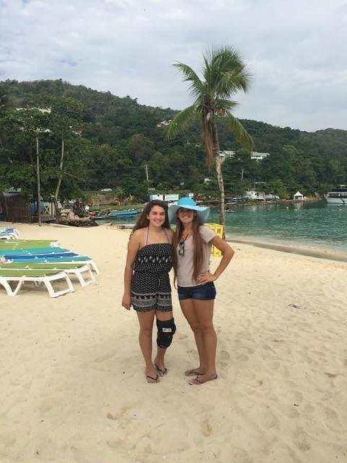 Communications junior Alana Gomez (left) stands with her sister, Brianna (right), in Ocho Rios, Jamaica.  