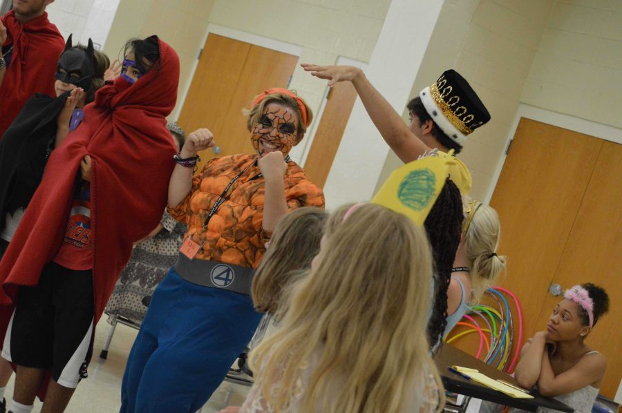 Communications junior Kayla Kirschenbaum has fun with campers as she dresses as the hero Thing from Fantastic Four.