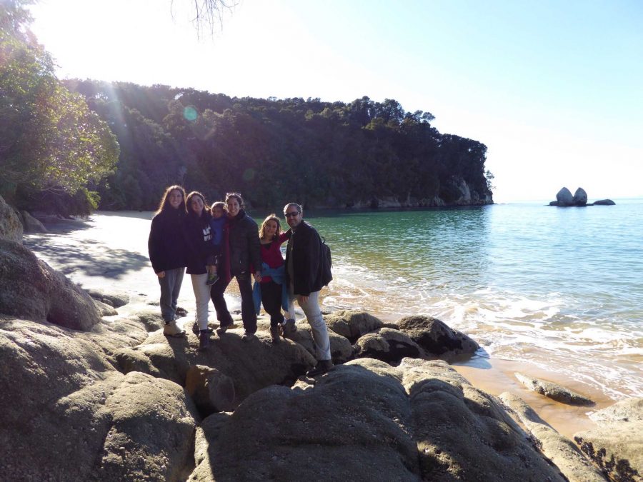 Communications junior Tom Kapitulnik  with her family at the Split Apple Rock beach.