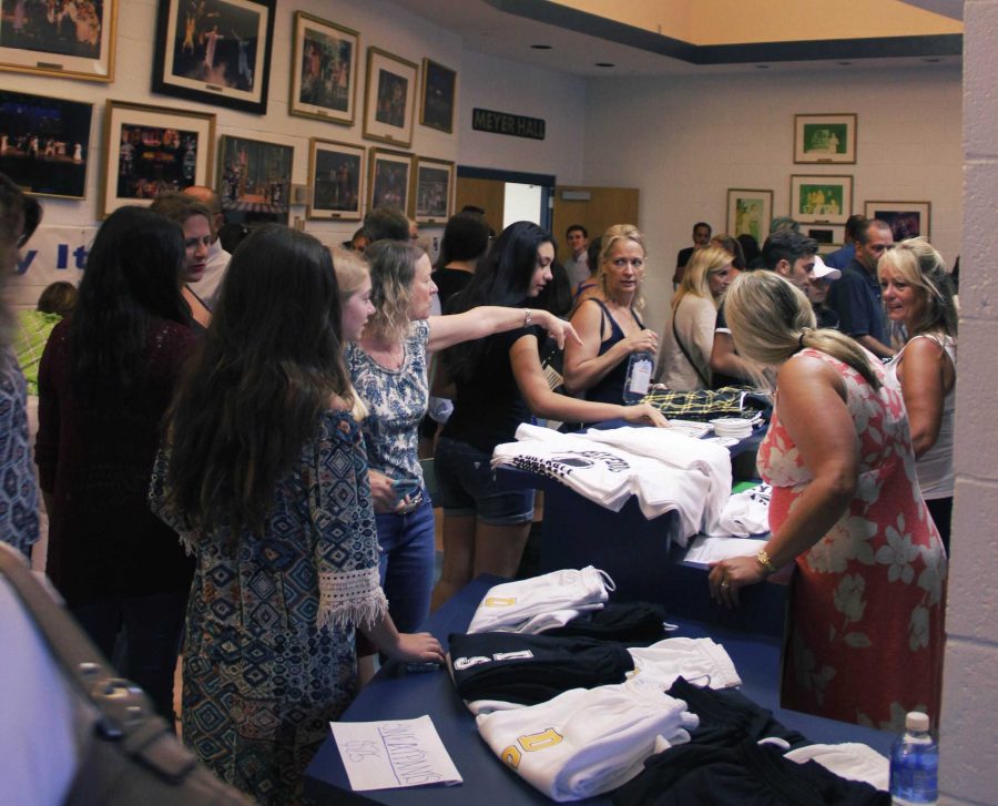 The PTA and Dreyfoos organizations sold merchandise for new students.