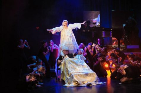 Theatre junior Emma McAvoy (back left) participates in a group scene during the Broadway Artists Intensive final showcase. 