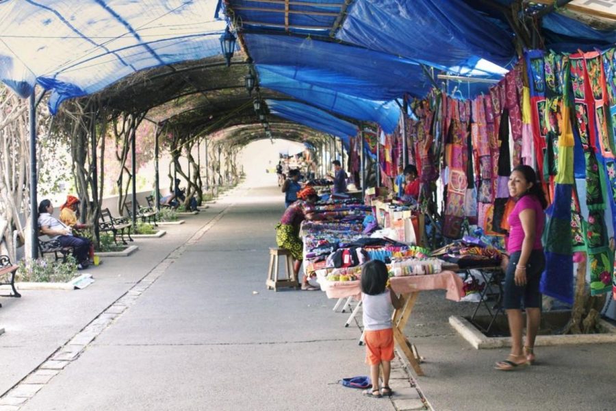 Guna indians from the San Blas Islands in Panama sell artisanal cloths known as molas and jewelry at a market in the capitals old quarter. The Gunas work is praised across the Panamanian isthmus for its bright colors and strong ties to Panamas indigenous culture.