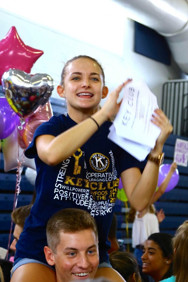 Dance seniors Savannah Alberty and Paul Rispoli draw attention and members to join Key Club during Club Rush on Sept. 10.