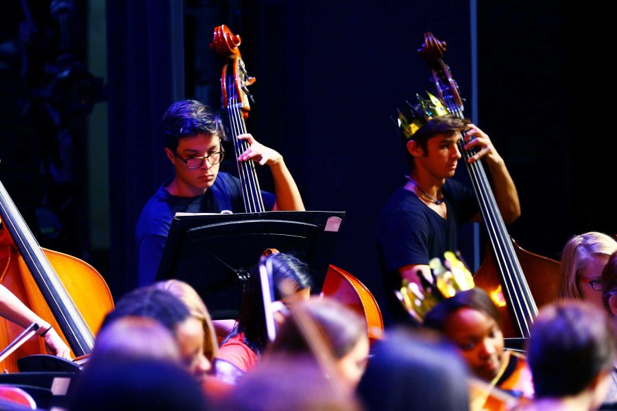 Strings senior Mateo Dorado (L-R) and strings sophomore Thomas Devito practice for the Philharmonic Concert. The concert will take place in Myer Hall tonight at 7 p.m.