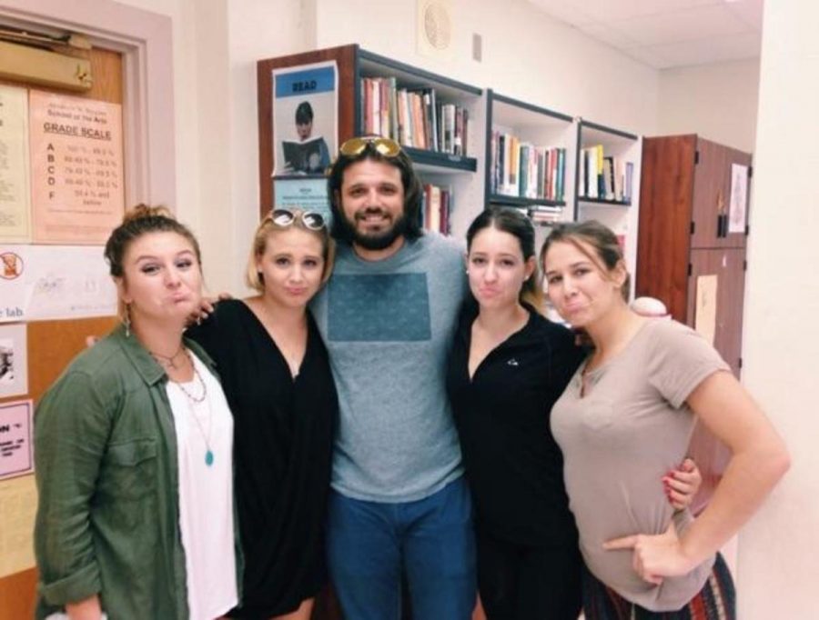 Donovan Ortega (pictured in middle) poses with his creative writing students, communications seniors Nyna Von Eps, (L-R) Emma Sue Harris, Sara Araoz, and Cassandra Adair on Sept. 30.
