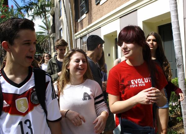 (L-R) Communications freshmen Johan Kramm,  Kayla Fischer, and Rebecca Nir talk while walking to the Muvico Parisian in CityPlace to watch He Named Me Malala, about the life of Malala Yousafzai. Incoming freshmen were required to read her book, I Am Malala over the summer. 
The movie was really inspiring to me,  Nir said. It was awesome to leave school and see a movie with all my friends.  