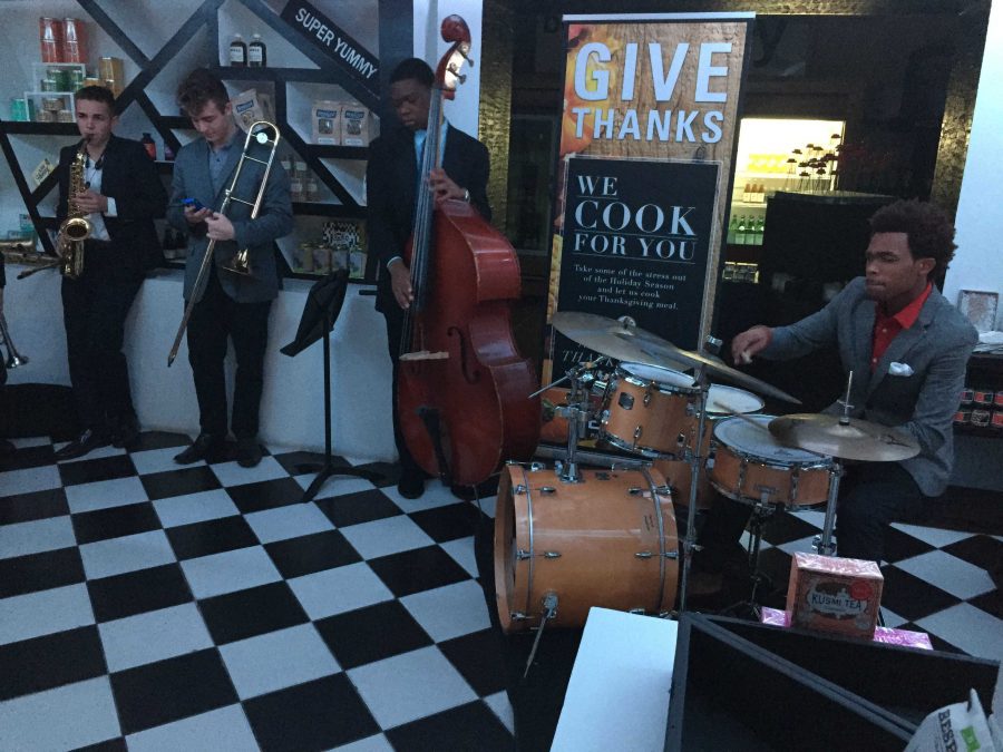 Near the main entrance of the EmKo Restaurant and Art Gallery, band juniors Tommy Gallagher (L-R), Nick Forte, Mark Ligonde, and Ahmad Johnson perform their Jazz Combos.