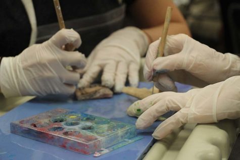 Students tattoo pieces of pig skin in science teacher Kristen Perez’s class. Participants received a  pig skin, a probe and a canvas filled with ink--and were free to create whatever designs they wished. 