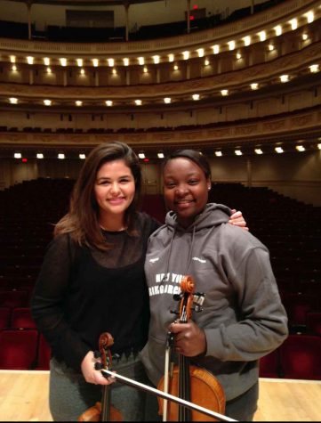 Strings senior Kevonna Shuford stands with her friend Allie Switala in Carnegie Hall. Both of them are alumni of the Sphinx Competition, and were Sphinx Representatives at the seminar.