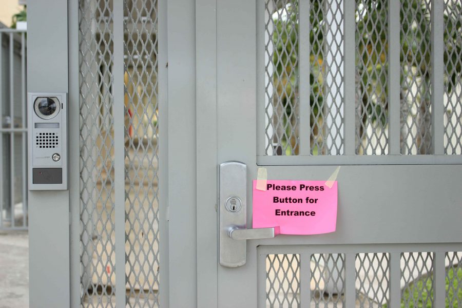 The new security button at the gate outside Building 1. Visitors will have to use it to gain permission from Mrs. Berryman in order to enter campus. 