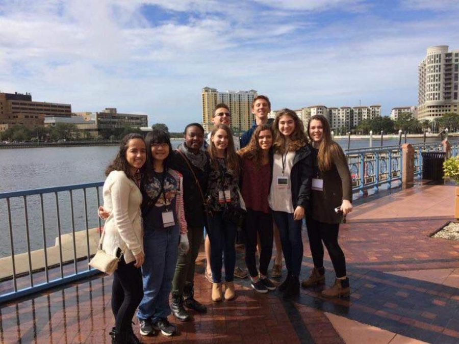 Strings senior Celine Castronuovo (L-R), strings junior Nozomi Yasuda, strings seniors Kevonna Shuford, Bailey Warren, Aaron Shulman, Tomas Bruderer, strings junior Sarah King, strings senior Juliet Schreiber, and strings junior Dana Esposito stand at the walkway outside of the Tampa Convention Center on Jan. 15. Dreyfoos music students attended the All-State Florida Music Educators Association Conference at the convention center from Jan. 13-16. 