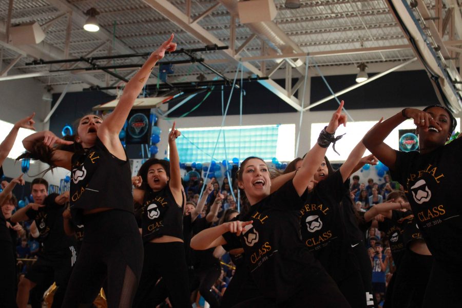 Dance senior Melanie Breaux (L-R), band senior Amber Chu, and dance seniors Francesca Horvath and Sierra Cooper dance in the seniors final Pep Rally Dance. Seniors won first place.