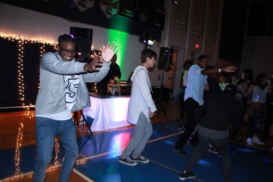 Vocal senior Josh Johnson (left) dances at Homecoming on Jan. 29. It was untraditional this year, with a House Party theme that allowed more casual attire and offered many games for students to play and win prizes.