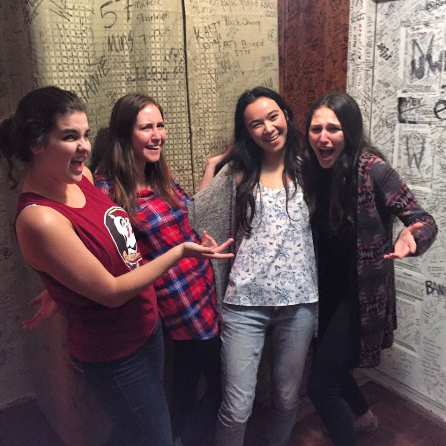 Spanish River senior Suzy Liss (L-R), Olympic Heights senior Julia Grober, communications senior Samantha Rose, and Spanish River senior Lucy Hotz celebrate after escaping the Room Amnesia room at QQuest Live Escape Games in Pompano Beach. The group applied logic to use clues throughout the room to find a way to escape in an hour.