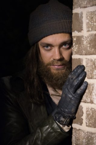 Paul "Jesus" Rovia peers from behind a wall