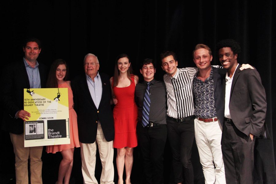 (L-R) Blair Brandt, theatre freshman Juliet Perel, school founder Alexander W. Dreyfoos Jr, theatre junior Rebecca Suskauer, theatre sophomore Daniel Rabinowitz, theatre seniors Zak Biggins, Maxime Prissert, and Dylan Jackson stand with wide smiles. 