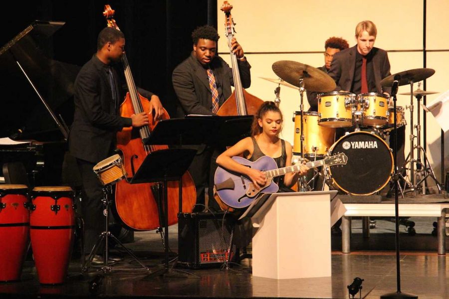 (L-R) Band seniors Ahmad Johnson,  Joshua Ewers, Garrett Anderson, and band sophomore Nikki Lickstein perform during a rendition of “Rotten Kid” “I dedicate this song to all the kids on stage because they stink,” Hernandez said. “But in all seriousness, when we performed this at the Central Jazz Competition, we were greeted with massive applause and asked to perform an encore.” 