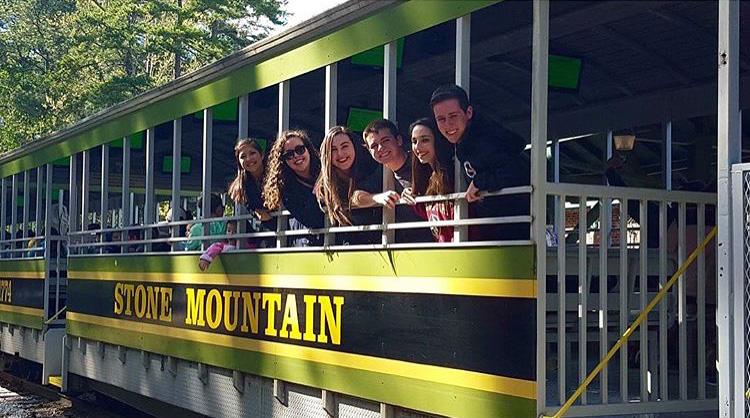 Vocal juniors Isabella Guerrero (L-R), Makayla Forgione, Michael Martin, Judianna Meyers-Sinett, and Jared Freedland ride the train at Stone Mountain Park the afternoon before the competition.