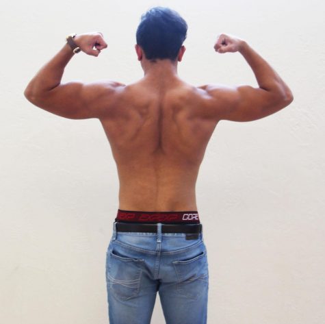 Beck flexes and shows off the current muscles in his back in Building 3.