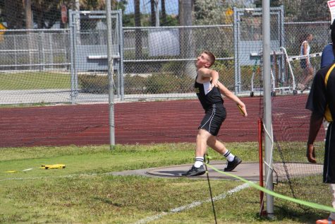 Dance senior Paul Rispioli winds up for a throw in the discus event. Rispioli broke the record for discus at Dreyfoos with a throw of 97 feet.