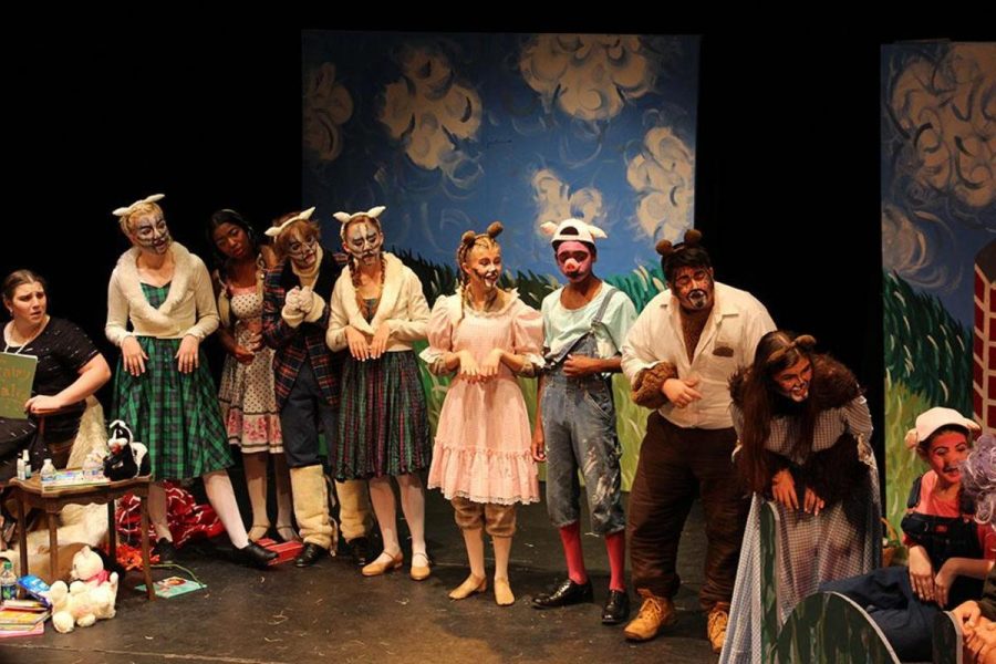 Theater sophomores Maddy Stillman (L-R), Lexi McCain, junior Nia Bourne, sophomore Chase Rook and Madison Burmeister, freshman Olivia Troast, juniors Michael Joseph and Jay Jennings, senior Grace Wess, and freshman Danielle Goldfine stand on the stage in a declaration of friendship and unity. After being displaced from their respective stories, the characters come together in the end and plan their futures together.