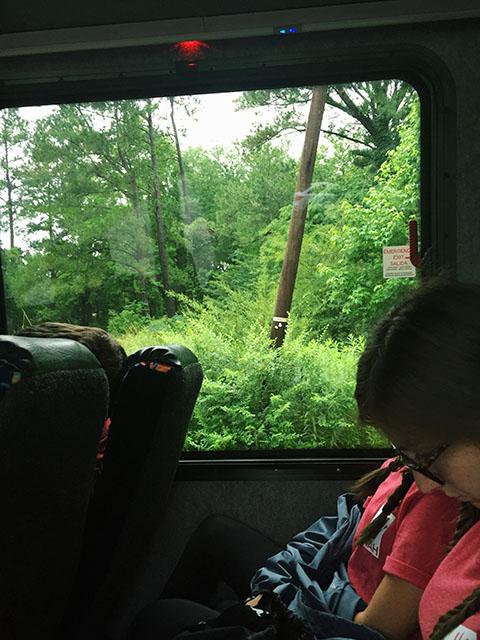 Outside the bus window, Georgetown, South Carolina is shown. Georgetown was a town that was significantly damaged by South Carolina's October floods, and Project Tikvah attendees went to people's homes to provide flood relief.